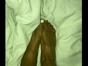 Ebony rubs feet