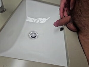 Hairy gay pissing in sink