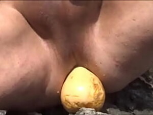 Inserting a big courgette up my asshole, on the beach - 1