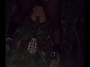 Enjoying the last full month of summer outdoors at midnight with guitar and ass showing