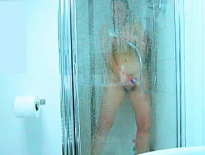 Curvy milf enjoys toy in the shower