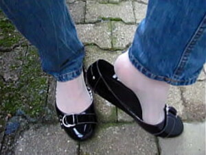 outdoor shoeplay by Isabelle-Sandrine, black patent ballet flats, jeans and nylons